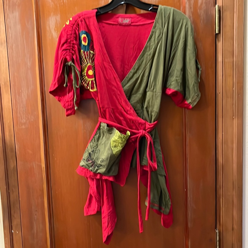 Festival style vibrant wrap top. Drawstring wide short sleeves. One size. French